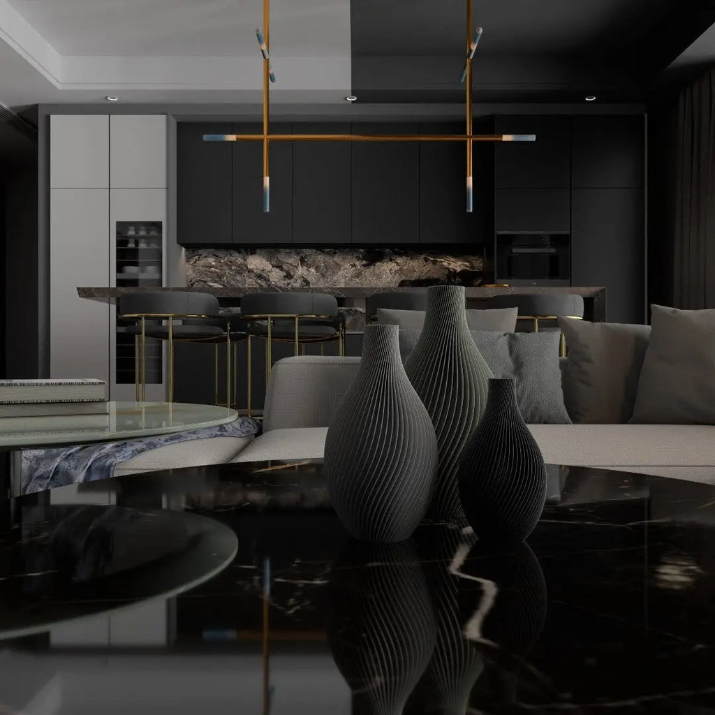 Modern living room with a black and white color scheme, featuring a sofa, coffee table, and decorative vases.